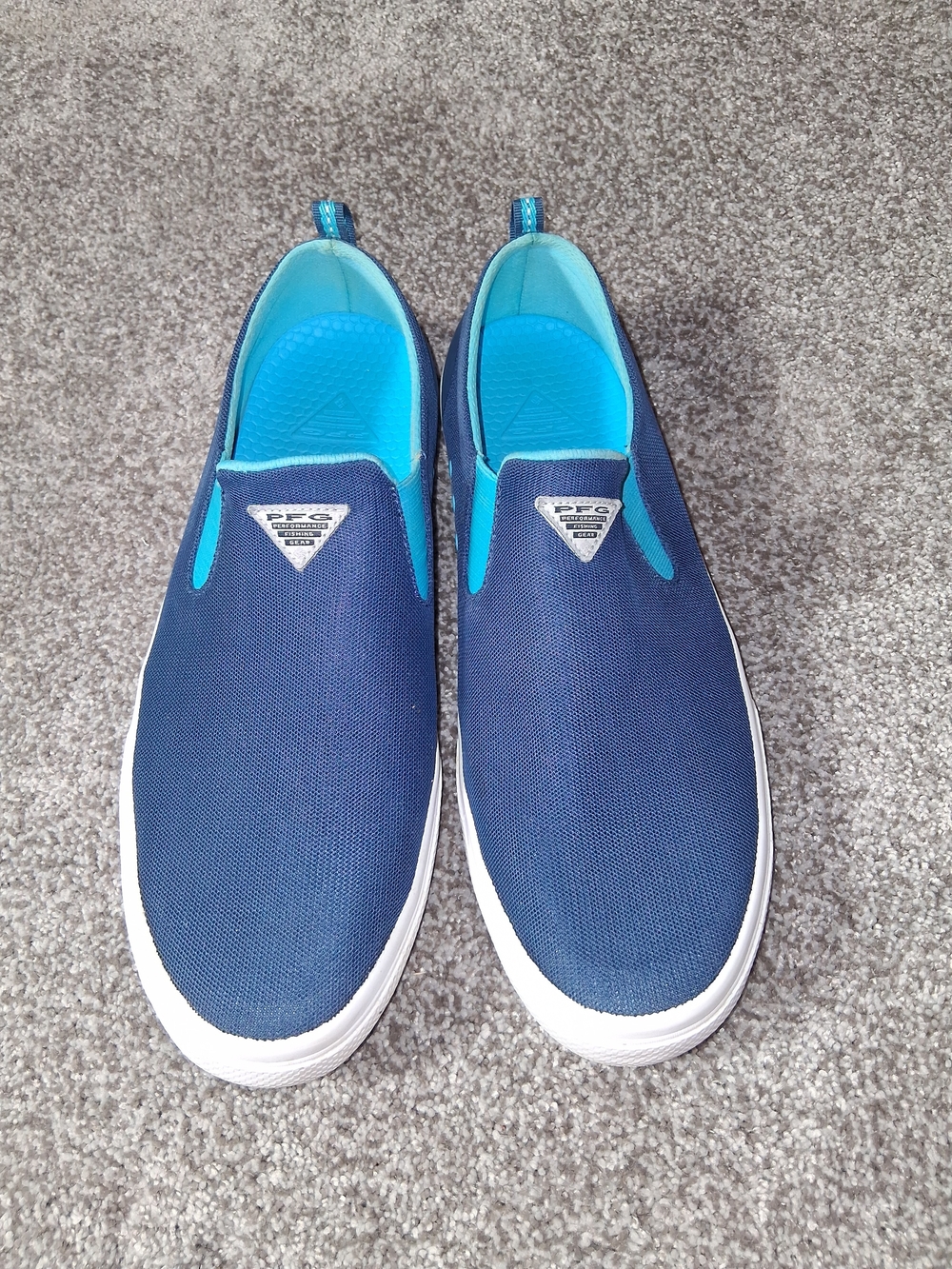 Columbia Distant Water PFG men's slip-on shoes in a blue and riptide color schem